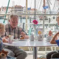 Family eating at Spinnaker Kitchen & Bar on the Portsmouth Harbour Waterfront