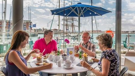 Family eating at Spinnaker Kitchen & Bar on the Portsmouth Harbour Waterfront