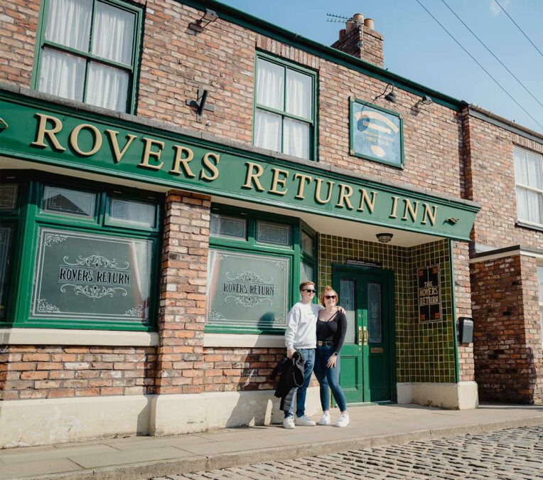 Guests outside the Rovers Return at the Coronation Street Experience